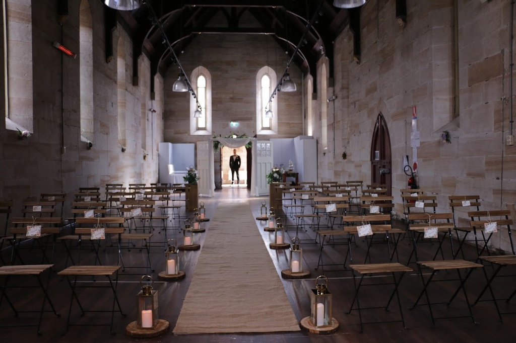 Medium Gold Lanterns with LED Pillar Candles on Wooden Slices